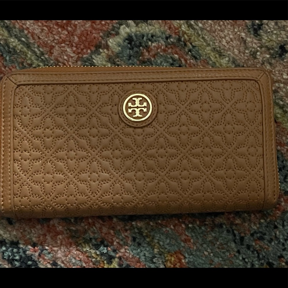 Gently used tan genuine leather Tory Burch wallet.